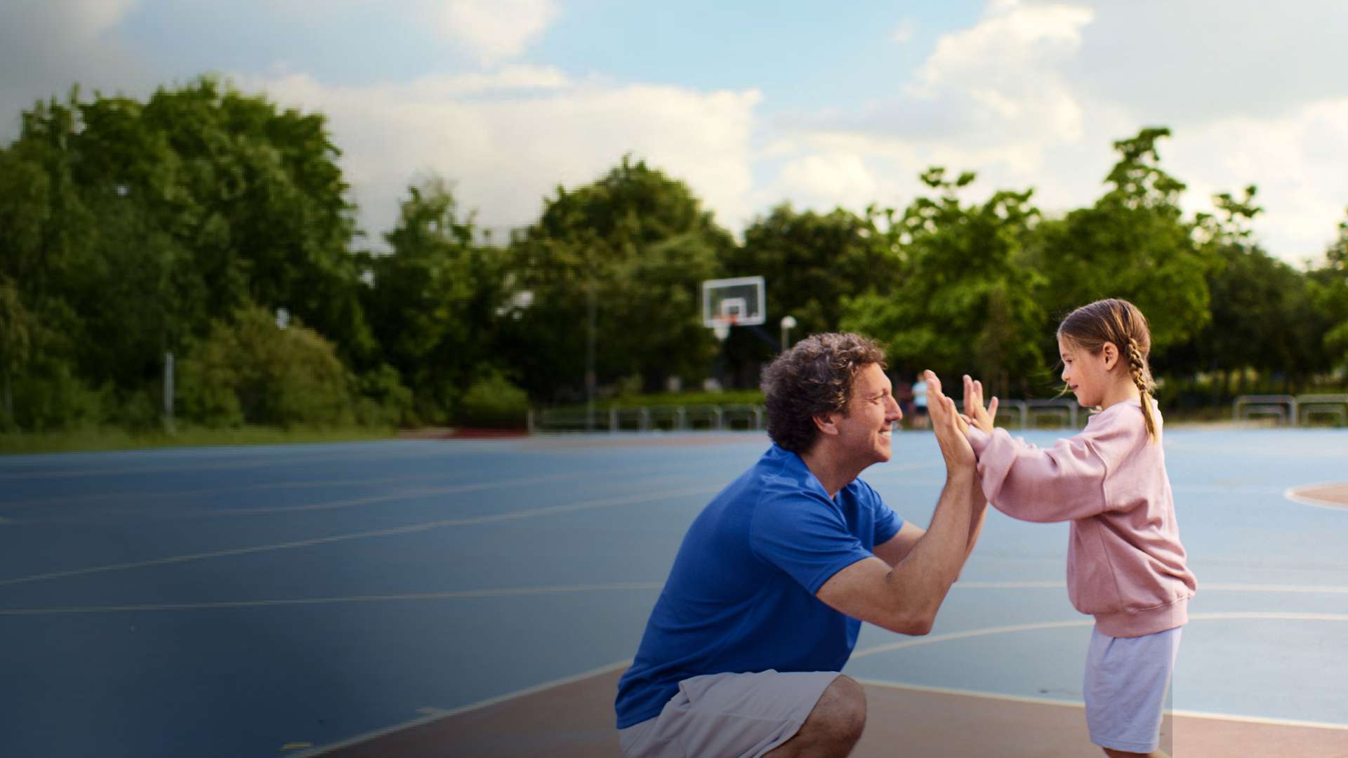 Actor portrayal of a Camzyos® (mavacamten) patient and his daughter givign a high-five