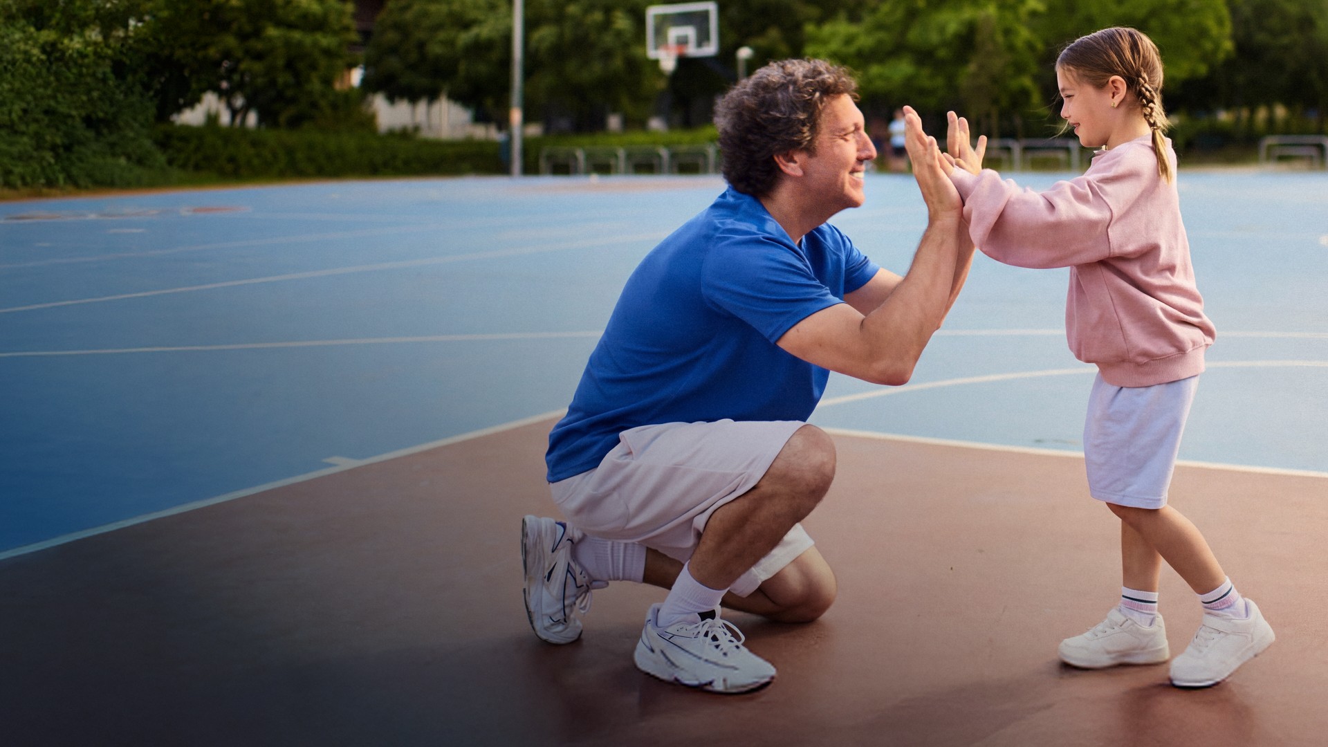 Actor portrayal of a CAMZYOS® (mavacamten) patient and a child talking.