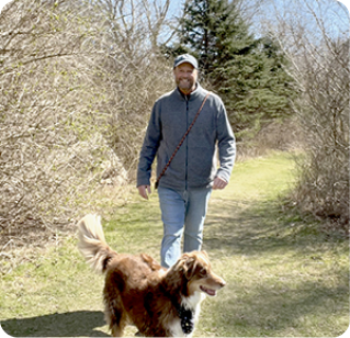 John, a Rx CAMZYOS® (mavacamten) patient, with his dog